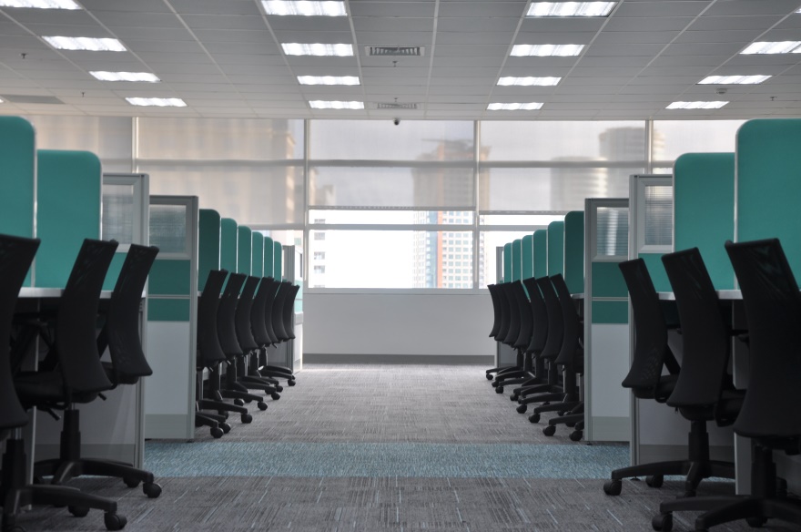 Empty Office Space With Desks In Cubicles